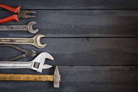 Variety of tools for wrenches on a dark wooden table. Copy space. Concept Happy Father's Day....