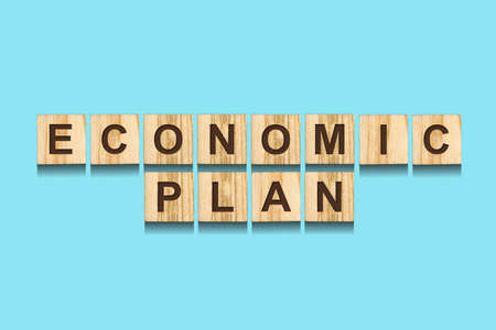 Economic Plan. The inscription on wooden blocks on a blue background. Plan for overcoming the...