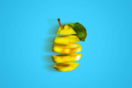 Fresh, ripe, cut pear on a blue background. Isolated. Natural organic fruits. Healthy lifestyleの写真素材