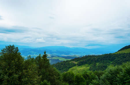 Beautiful mountain landscape with low clouds. Ukraine. Carpathians. Recreation Travelsの写真素材
