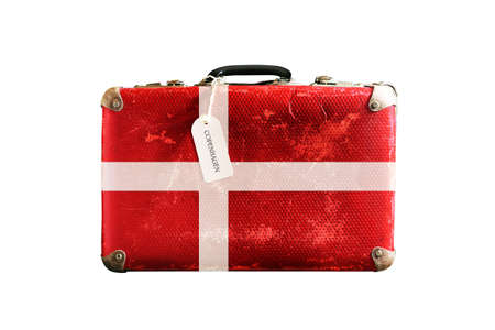 Old suitcase with the flag of Denmark. Isolated on a white background