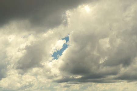 Beautiful rain clouds illuminated by the sun. Close-up.の写真素材