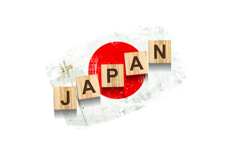 Japan. The inscription on wooden blocks, against the background of the flag of Japan. Isolated on a white background. Design elementの写真素材