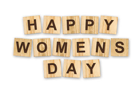 Happy woman's day, the inscription composed of the alphabet on wooden cubes. White background....
