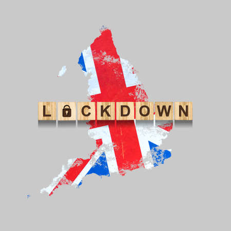 Lockdown. England. The inscription on wooden blocks, against the background of the map of England....