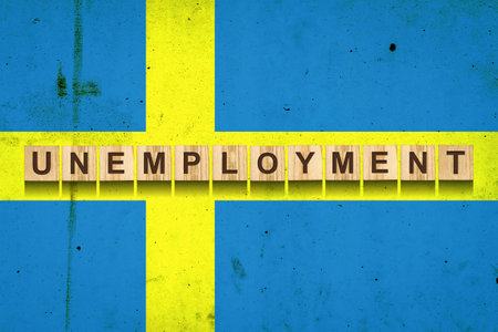 Unemployment. The inscription on wooden blocks on the background of the Sweden flag. Unemployment growth. Business. Job.の写真素材