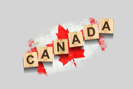 Canada. The inscription on wooden blocks, against the background of the flag of Canada. 3D illustration. Isolated on a gray background. Design elementの写真素材