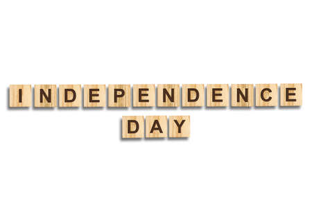Independence Day. The inscription on the wooden blocks. Isolated. Independence Day United States of America background. Festive background. Background.の写真素材