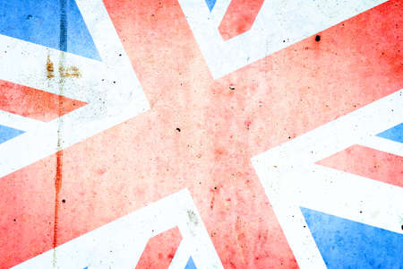 Flag of Britain on an old concrete wall. Backgrounds Textures.の写真素材