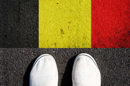 Sneakers and the Belgium flag. View from above. Travels.