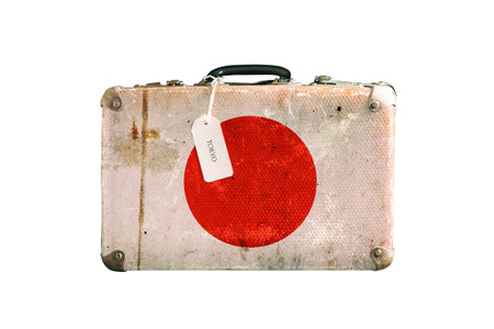Old suitcase with the flag of Japan. Isolated on a white backgroundの写真素材