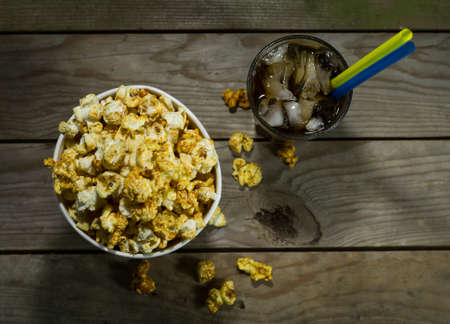 Popcorn and cola on the black backgroundの写真素材
