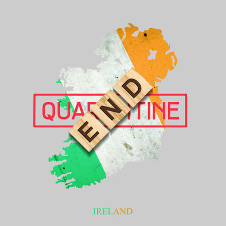 End of quarantine. The inscription on wooden blocks on the background of the map of Ireland. The end...