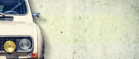 The headlight of the old beautiful car on the background of a concrete wall. Copy space. Concept...