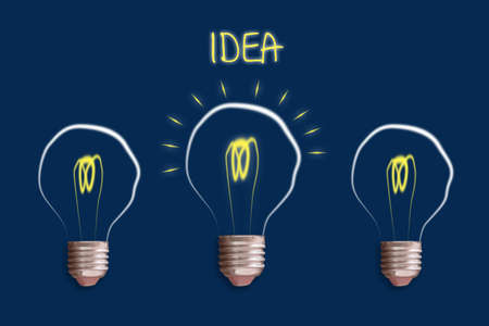 Concept Idea. Light bulb on a blue background. The concept of bright ideas for business, frequently...