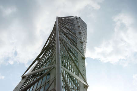 Malmo. Sweden. July 29.2019. Turning Torso, a beautiful skyscraper against a cloudy sky. View from below Architecture. Attractionsのeditorial素材