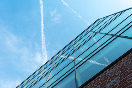 Malmo Sweden. July 29.2019 Modern mirror building on a background of cloudy sky. Bottom view Architecture.Sights.のeditorial素材