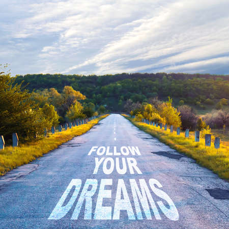 Follow your dream. Written on road. Achievement of the goal. Business.の写真素材