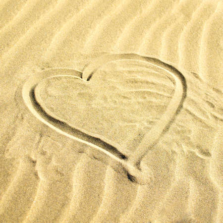 The contour of the heart in the sand. Square orientation. Natural background.の写真素材