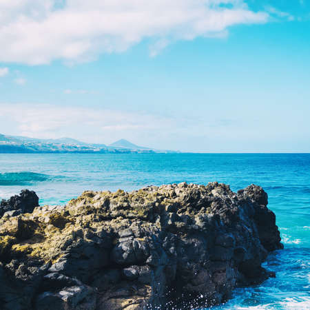 Rocky ocean coast. Close-up. Square orientation. Natural background.の写真素材
