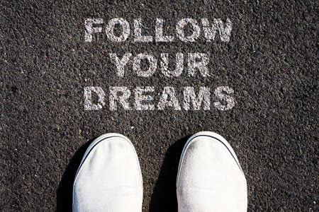 Follow your dream. Written down the road. Sneakers.Top view. Achievement of the goal. Business.の写真素材