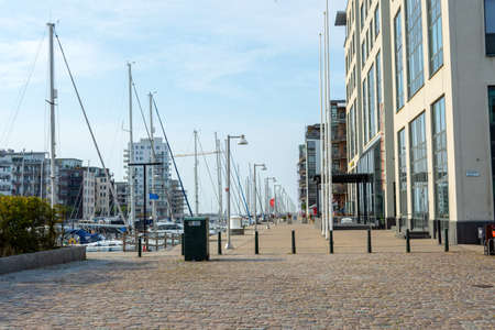 Malmo. Sweden. July 29, 2019. Beautiful urban modern architecture, on the banks of the canal, with street lamps, and yachts in the parking lot. Architecture.のeditorial素材