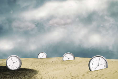 Clock in the sand dunes. Show different times. Cloudy sky. Time concept. Business. Life style. Abstraction background.の写真素材