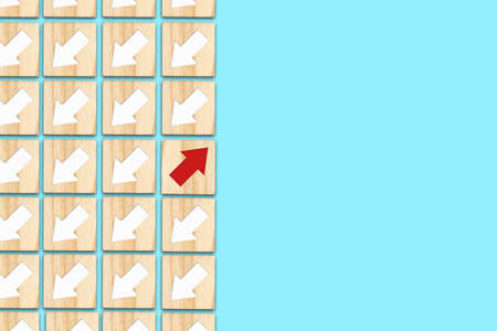 Wooden blocks with white and red arrows. Different directions. Leadership success concept. Innovative solution. Individual concept. Right choice. Career growth. Business.の写真素材