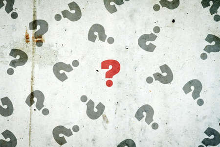 Question marks on a concrete wall. The concept of questions and answers. Business. Lifestyle. Background.の写真素材