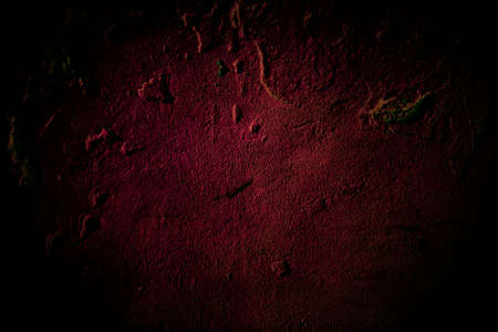 Dark red texture, old cracked wall. Vignette. Backgrounds textureの写真素材