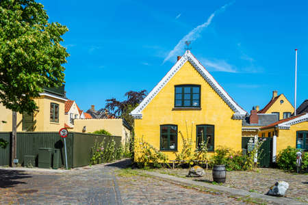 Dragor. Denmark. July 24, 2019 Beautiful, small, yellow rustic houses. Traditional Scandinavian style. Fishing village Sights Travelsのeditorial素材