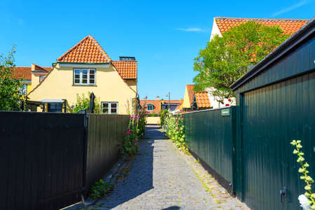 Dragor. Denmark. July 24, 2019 Beautiful, small, yellow rustic houses. Traditional Scandinavian style. Fishing village Sights Travelsのeditorial素材