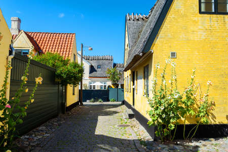 Dragor. Denmark. July 24, 2019 Beautiful, small, yellow rustic houses. Traditional Scandinavian style. Fishing village Sights Travelsのeditorial素材