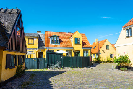 Dragor. Denmark. July 24, 2019 Beautiful, small, yellow rustic houses. Traditional Scandinavian style. Fishing village Sights Travelsのeditorial素材