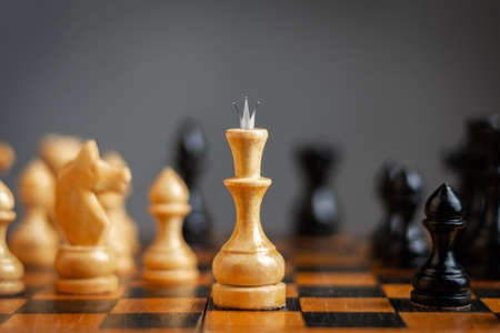 White queen, among the chess pieces. Strategy concept. Victory. Success. Business Lifestyle Backgroundの写真素材