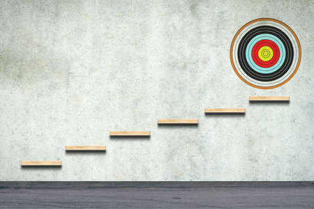 Ladder to the target, on a concrete wall. Concept of the path to the right goal. business. lifestyle. abstraction. background.の写真素材