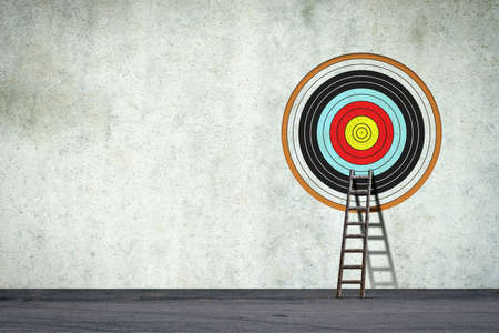 Ladder to the target, on a concrete wall. Concept of the path to the right goal. business. lifestyle. abstraction. background.の写真素材