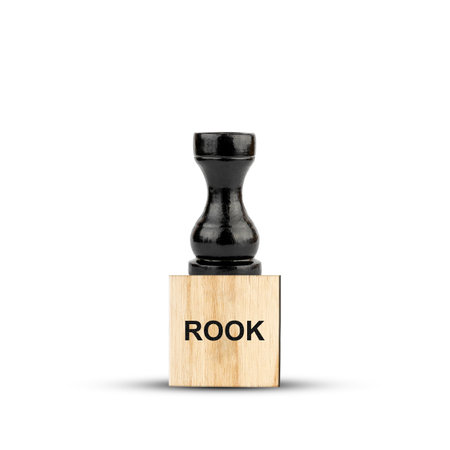 Black Chess Rook, on a wooden block. isolated on a white background. The game. training. Education. design element.の写真素材