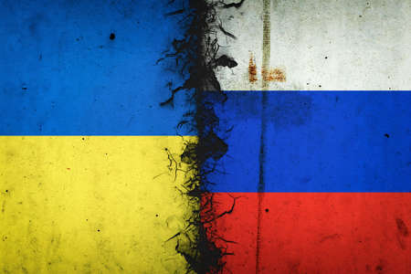Cracked flags of Russia and Ukraine. international political relations. conflict. political economic background. politics.の写真素材
