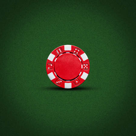 Red poker chip, on a dark green background. Gambling. background.の写真素材