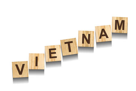 Vietnam, word on wooden blocks. isolated on a white background. Signs and Symbols.の写真素材