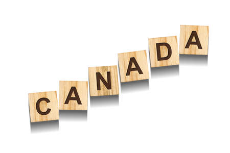 Canada word on wooden blocks. isolated on a white background. Signs and Symbols.の写真素材