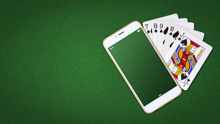 Playing cards and smartphone on a green background. Online poker concept.Online Casino. copyspace. top view. Gambling. background.の写真素材