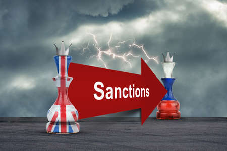 British sanctions against Russia. Chess queens in the colors of the English and Russian flags. The collapse of the economy. economic blockade. economic background.の写真素材