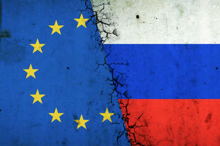 Cracked Euro Union and Russia flags. Rupture of economic relations. sanctions. economic crisis. War between Russia and Ukraine. economic blockade.の写真素材