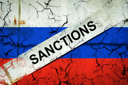 Cracked flag of Russia, crossed out, the word Sanctions. Russian aggression. politics. Economy economic crisis. The collapse of the economy.の写真素材