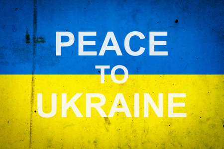 Peace to Ukraine. Words on the background of the flag of Ukraine. stop war.の写真素材