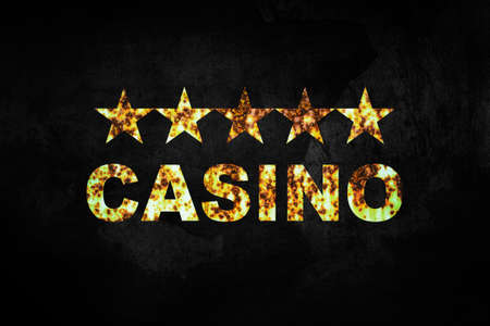 Casino, grunge inscription, on a black cracked background. poker concept. Gambling backgroundの写真素材