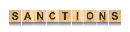 sanctions. Word on wooden blocks. isolated on white background. business. Politics Economyの写真素材