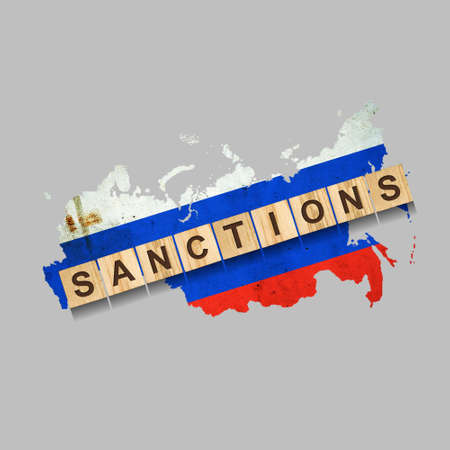 sanctions. Word on wooden blocks. Against the background of the map of Russia. Isolated on a gray background. business. politics. Economyの写真素材